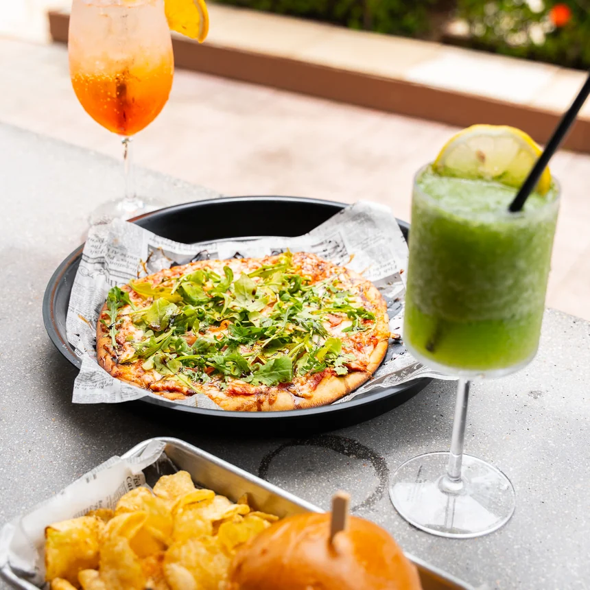 Coastal food and drinks served by the pool at Vivo Beach Club