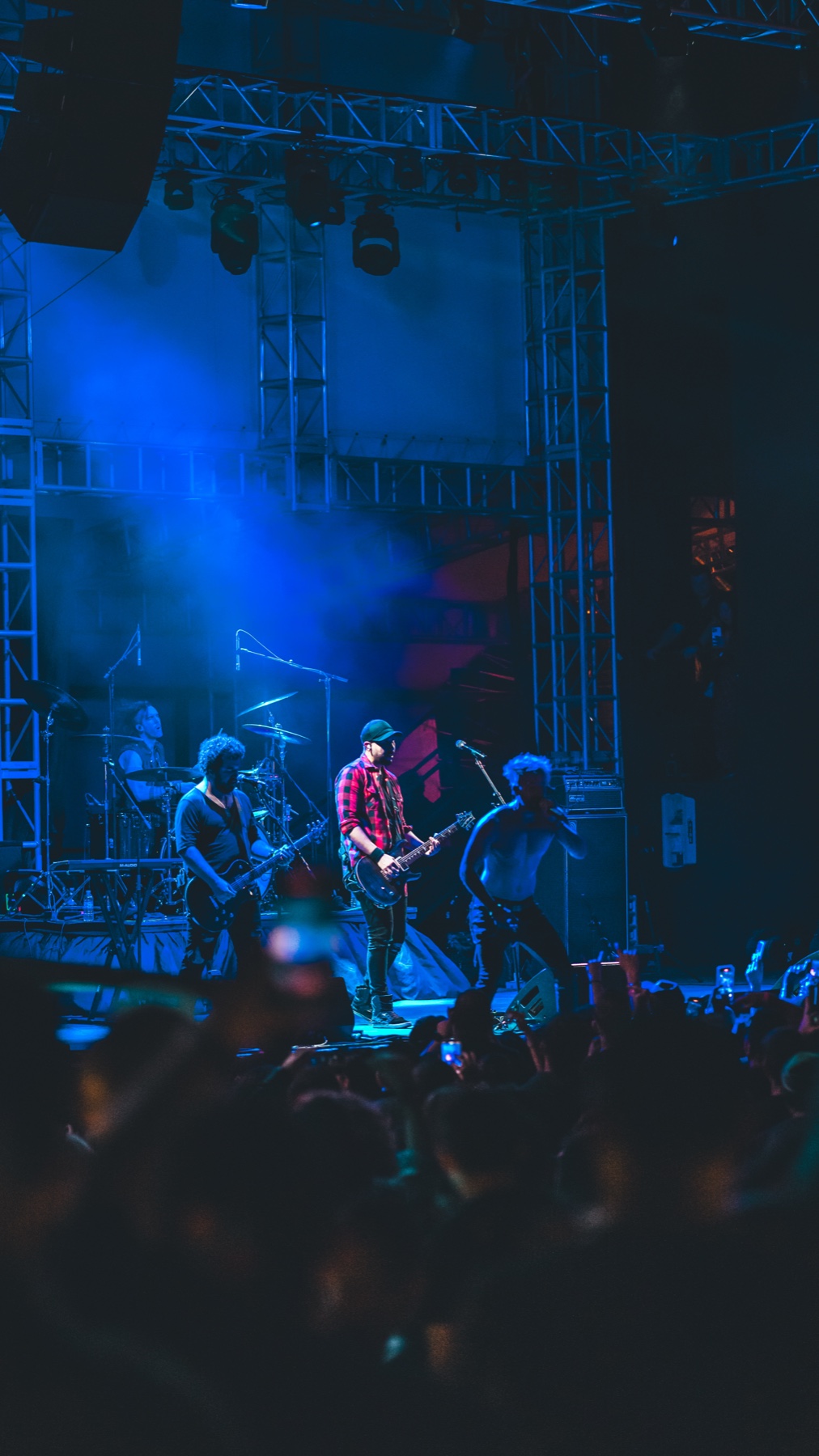 Linkin Park Experience band performing under blue stage lighting at Vivo Beach Club