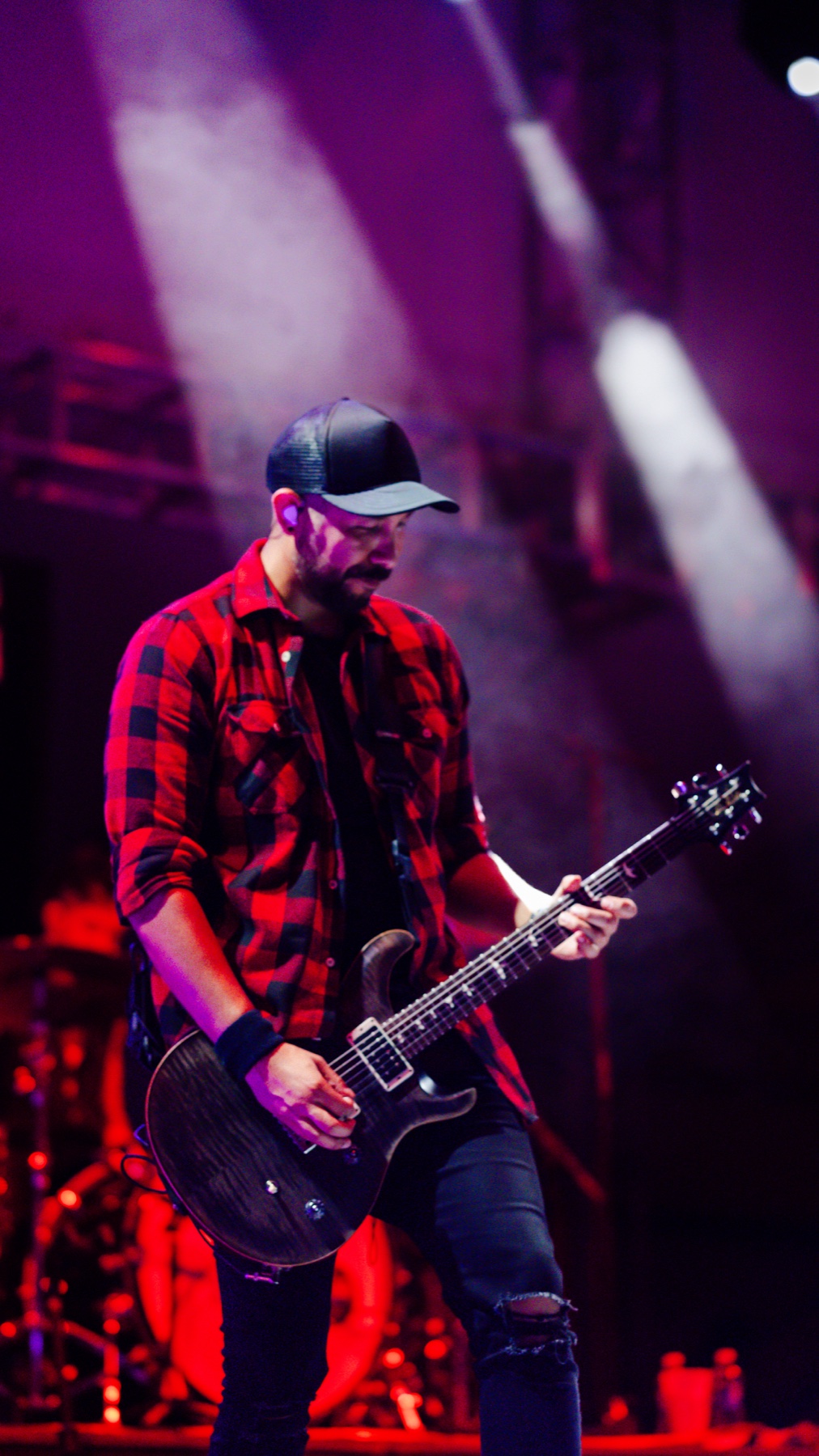 Linkin Park Experience guitarist performing in red stage lighting at Vivo Beach Club