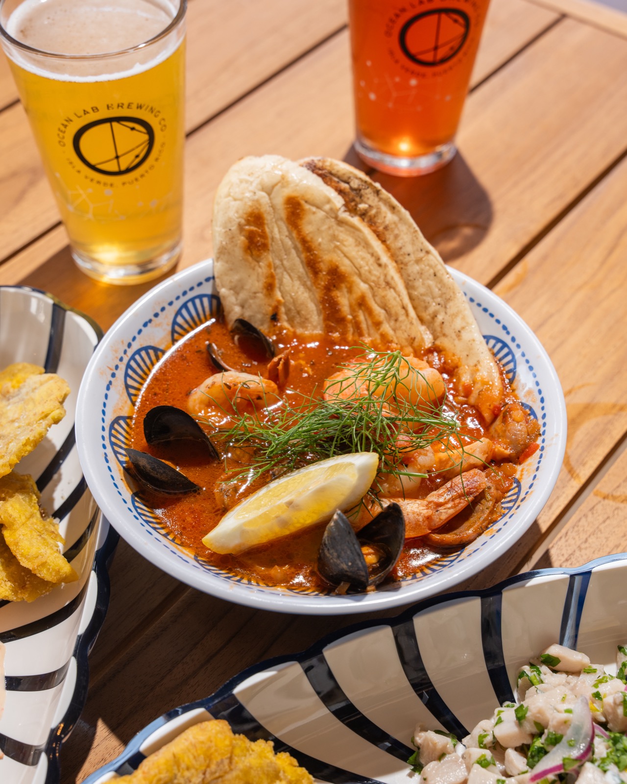 Seafood paella with Ocean Lab beers at Vivo Beach Club