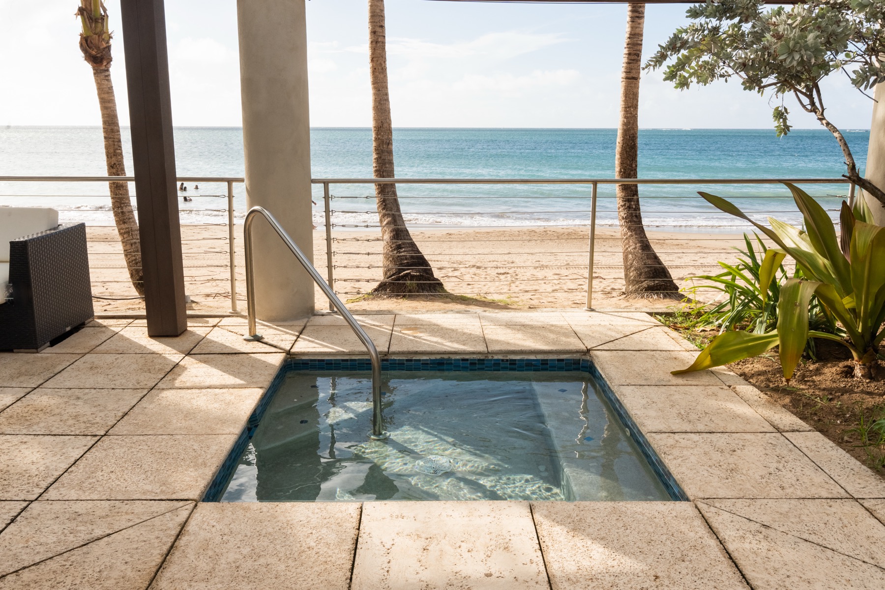 Oceanfront Jacuzzi at Vivo Beach Club with beach views and palm trees