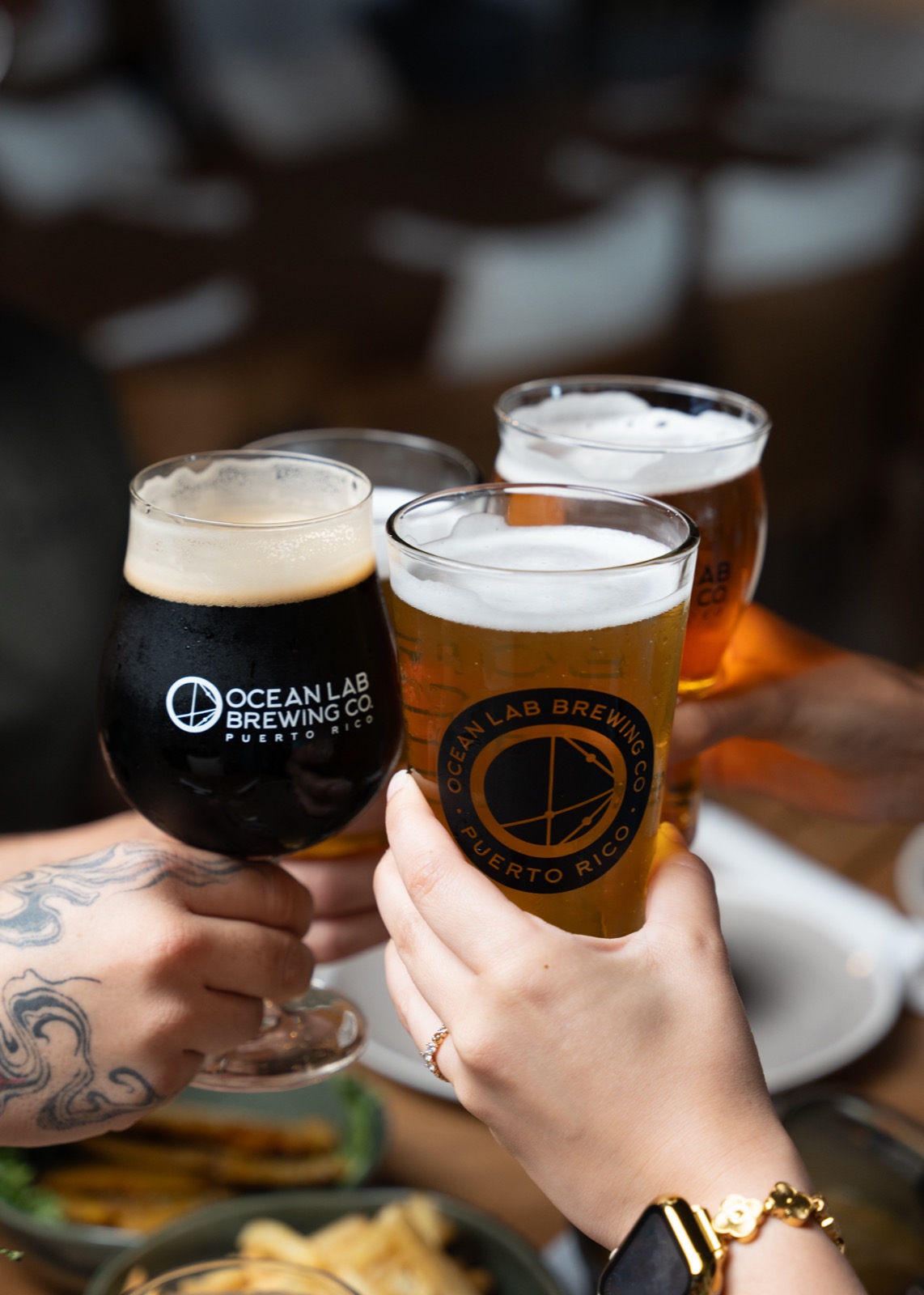 Ocean Lab beers raised in a toast at Vivo Beach Club