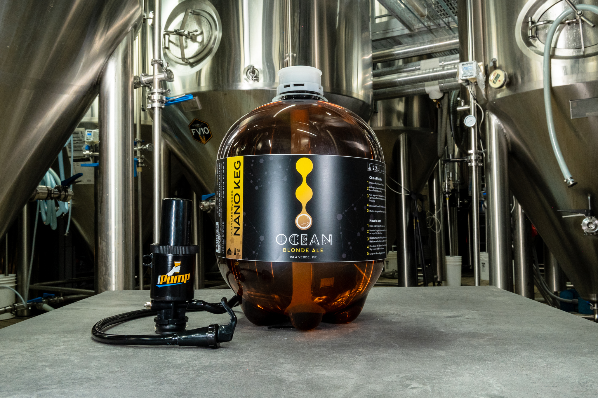 Ocean Lab Blonde Ale nano keg in front of brewery tanks