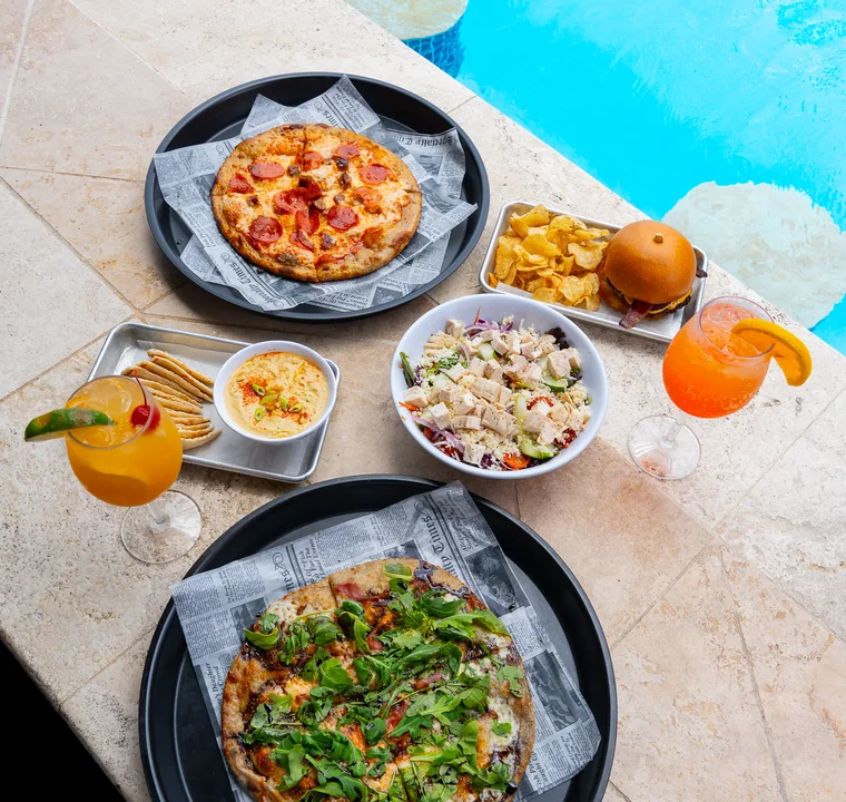 Shared coastal dining table at Vivo Beach Club